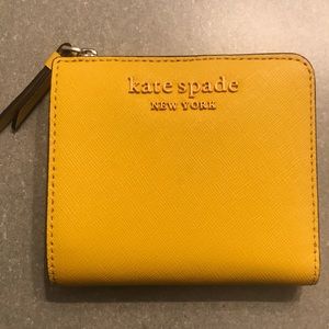 Brand new Kate Spade fold wallet mustard yellow